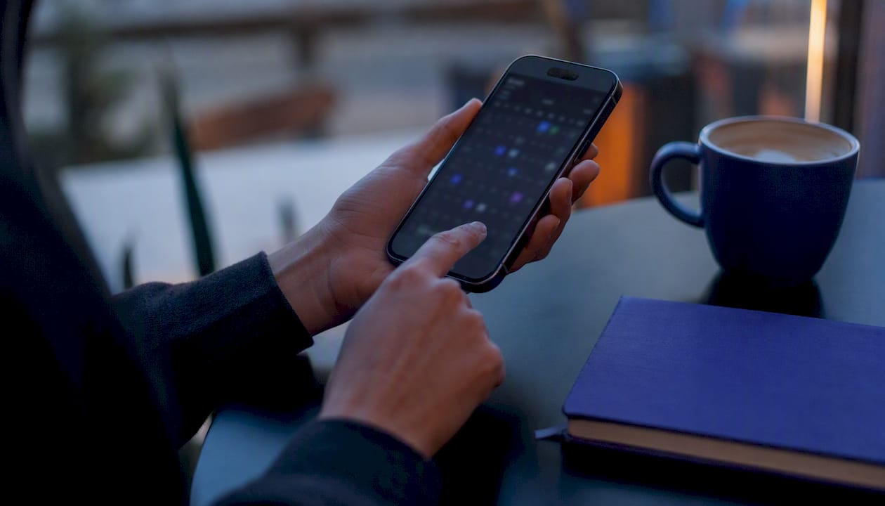 Hands planning workforce staffing on tablet